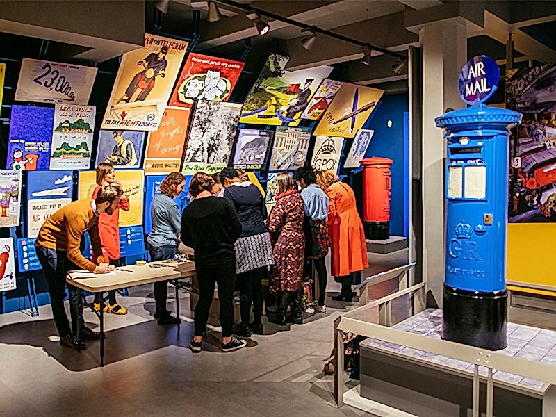 A group of people attend a tour at the museum