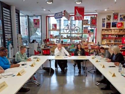 Members of the project seated at a roundtable discussion.